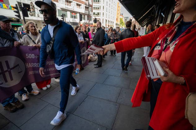 September 18, 2026, London, United Kingdom: A protester hands out leaflets during a demonstration outside the main entrance to the Harrods department store in Knightsbridge. Survivors of alleged sexual abuse by former Harrods owner Mohamed Al Fayed and their supporters hold a demonstration outside Harrods department store in Knightsbridge, London. Protesters held placards, handed leaflets to members of the public and stood behind a large campaign banner outside the store entrance. The survivors are calling for the findings of a previous inquiry into allegations against Al Fayed to be made public and for a further public inquiry to examine the allegations and establish the truth surrounding the claims. London United Kingdom  - ZUMAs197 20260918_aaa_s197_023 Copyright: xJamesxWilloughbyx