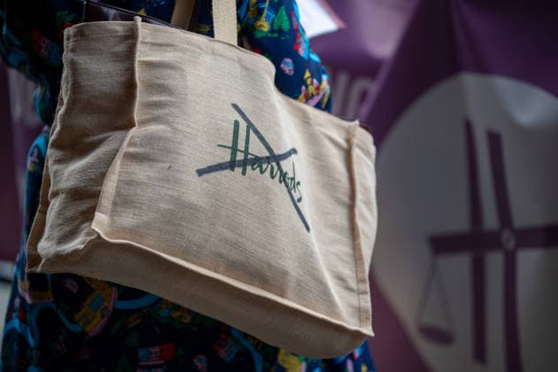 September 18, 2026, London, United Kingdom: A Harrods shopping bag with its logo crossed out seen during the demonstration outside the Harrods department store in Knightsbridge. Survivors of alleged sexual abuse by former Harrods owner Mohamed Al Fayed and their supporters hold a demonstration outside Harrods department store in Knightsbridge, London. Protesters held placards, handed leaflets to members of the public and stood behind a large campaign banner outside the store entrance. The survivors are calling for the findings of a previous inquiry into allegations against Al Fayed to be made public and for a further public inquiry to examine the allegations and establish the truth surrounding the claims. London United Kingdom  - ZUMAs197 20260918_aaa_s197_026 Copyright: xJamesxWilloughbyx