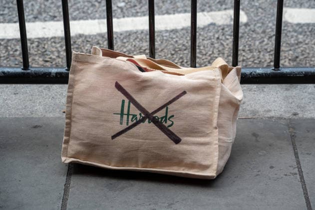 September 18, 2026, London, United Kingdom: A Harrods shopping bag with its logo crossed out seen during the demonstration outside the Harrods department store in Knightsbridge. Survivors of alleged sexual abuse by former Harrods owner Mohamed Al Fayed and their supporters hold a demonstration outside Harrods department store in Knightsbridge, London. Protesters held placards, handed leaflets to members of the public and stood behind a large campaign banner outside the store entrance. The survivors are calling for the findings of a previous inquiry into allegations against Al Fayed to be made public and for a further public inquiry to examine the allegations and establish the truth surrounding the claims. London United Kingdom  - ZUMAs197 20260918_aaa_s197_030 Copyright: xJamesxWilloughbyx