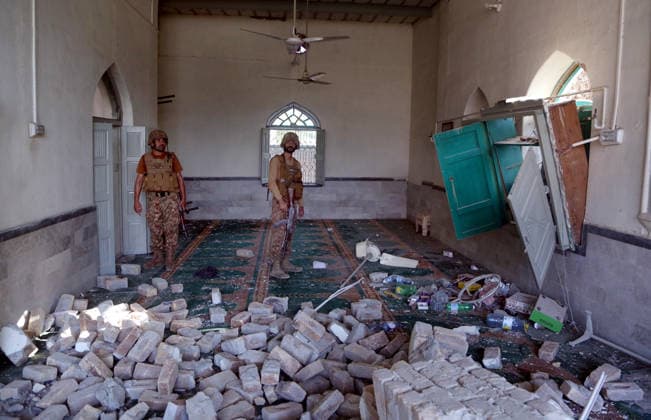 16 killed in suspected suicide bombing near police compound in NW Pakistan KHYBER PAKHTUNKWA, PAKISTAN - SEPTEMBER 18: Security officials inspect the site of a blast at a mosque near the Old Police Lines in Kohat district of Khyber Pakhtunkhwa province, Pakistan, on September 18, 2026. At least 16 people, including 11 civilians and five police officers, were killed and over 50 others wounded in a suspected suicide bombing targeting a police compound in northwestern Pakistan during Friday congregational prayers, officials said. The casualties occurred when an explosives-laden vehicle rammed into the Old Police Lines gate in Kohat district of Khyber Pakhtunkhwa province, a senior police official said, according to local broadcaster Geo News.  Copyright: x2026xAnadoluxHussainxAlix
