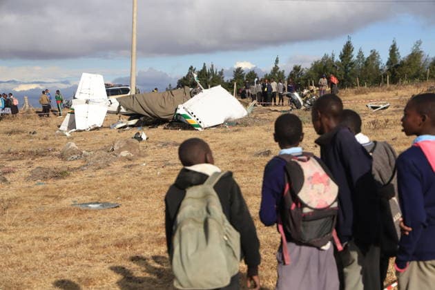 Training aircraft crashes in Kenya, two people lose their lives KAJIADO, KENYA - SEPTEMBER 18: Students look at the scene as emergency teams inspect the crash site after a training aircraft crashes in Kipeto, Kajiado County, Kenya, on September 18, 2026. Two people lost ther lives in the crash. Lucas Mukasa Anadolu Kajiado Kenya. Editorial use only. Please get in touch for any other usage.  Copyright: x2026xAnadoluxLucasxMukasax