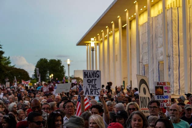 Demonstrators participate in the Hands Off the Arts Kennedy Center protest, objecting to President Donald Trump s call for the possibility of demolishing the Kennedy Center at the John F. Kennedy Center for the Performing Arts on Friday, September 18, 2026 in Washington DC. Several hundreds of activists held signs and walked the premises calling for President Trump to be removed as the chairman of the Kennedy Center.  WAP20260918918 LeighxVogel