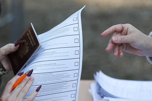 RUSSIA, PENZA - SEPTEMBER 19, 2026: A woman receives a woman election official with a mobile ballot box at the Meridian sports and health camp to vote in the 2026 Russian legislative election held on September 18-20, including regional parliamentary and local elections, as well as the election to the Russian State Duma of the 9th convocation. Yegor Aleyev TASS  97941057