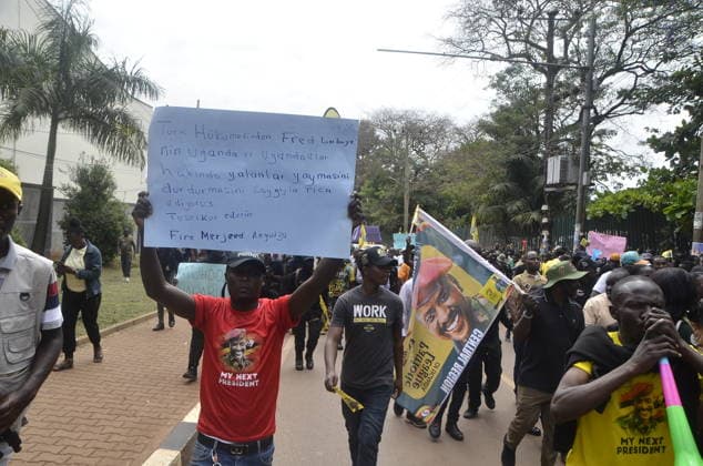 Police block Ugandans protesters at Turkish embassy. Uganda, Kampala - September 18, 2026: Police block Ugandans protesters at Turkish embassy. KAMPALA, Sept. 18. Police Battled with hundreds of Ugandans protesters who tried to access the Turkish Embassy in Kampala capital city Uganda on Friday. The protesters under political pressure group, Patriotic League of (PLU), head by the Country’s Chief of Defence forces(CDF), Gen. Muhoozi Kainerugaba had forcefully tried to access the Turkish embassy located in Kololo, Kampala capital city. Earlier on at around 8.30am in the morning the group converged at lugogo cricket oval grounds, Kampala capital city and they started matching holding placards and banners. The banners and placards had words li Copyright: xx