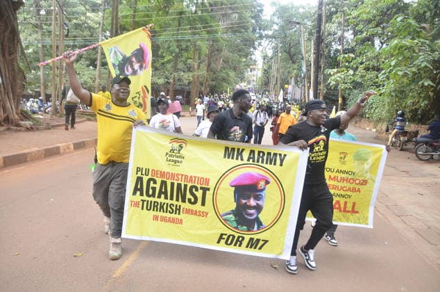 Police block Ugandans protesters at Turkish embassy. Uganda, Kampala - September 18, 2026: Police block Ugandans protesters at Turkish embassy. KAMPALA, Sept. 18. Police Battled with hundreds of Ugandans protesters who tried to access the Turkish Embassy in Kampala capital city Uganda on Friday. The protesters under political pressure group, Patriotic League of (PLU), head by the Country’s Chief of Defence forces(CDF), Gen. Muhoozi Kainerugaba had forcefully tried to access the Turkish embassy located in Kololo, Kampala capital city. Earlier on at around 8.30am in the morning the group converged at lugogo cricket oval grounds, Kampala capital city and they started matching holding placards and banners. The banners and placards had words li Copyright: xx