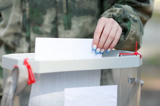 RUSSIA, PENZA - SEPTEMBER 19, 2026: A woman casts her vote at a mobile ballot box at the Meridian sports and health camp during the 2026 Russian legislative election held on September 18-20, including regional parliamentary and local elections, as well as the election to the Russian State Duma of the 9th convocation. Yegor Aleyev TASS  97942122