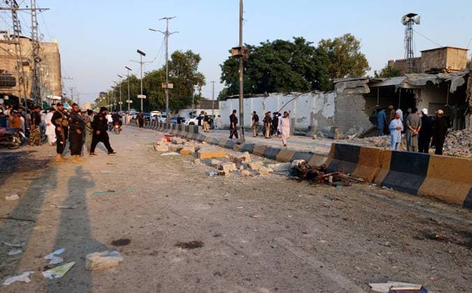 (260919) -- KOHAT, Sept. 19, 2026 () -- This photo taken with a mobile phone shows people gathering at the bomb attack site in Kohat of Khyber Pakhtunkhwa province, Pakistan, Sept. 18, 2026. As many as 31 people, including 16 police officers, were killed and over 100 others injured in a twin suicide attack inside a police residential compound in Pakistan s northwestern Khyber Pakhtunkhwa province on Friday, police said on Saturday. (Str ) (SpotNews)PAKISTAN-KHYBER PAKHTUNKHWA-KOHAT-SUICIDE ATTACK-DEATH TOLL Xinhua