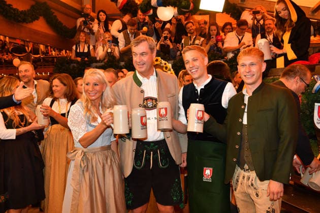 Markus Söder with his wife Karin and Dominik Krause, Mayor of Munich, with his partner Sebastian Müller; Oktoberfest 2026 beer tapping ceremony at Theresienwiese, Schottenhammel Festzelt, Munich, September 19, 2026