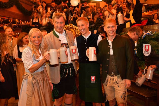 Markus Söder with his wife Karin and Dominik Krause, Mayor of Munich, with his partner Sebastian Müller; Oktoberfest 2026 beer tapping ceremony at Theresienwiese, Schottenhammel Festzelt, Munich, September 19, 2026