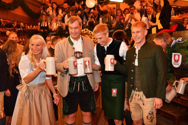 Markus Söder with his wife Karin and Dominik Krause, Mayor of Munich, with his partner Sebastian Müller; Oktoberfest 2026 beer tapping ceremony at Theresienwiese, Schottenhammel Festzelt, Munich, September 19, 2026