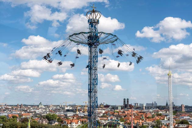 Oktoberfest 2026, view from the Ferris wheel of the BayernTower, with the city of Munich and its landmark, the Frauenkirche, o