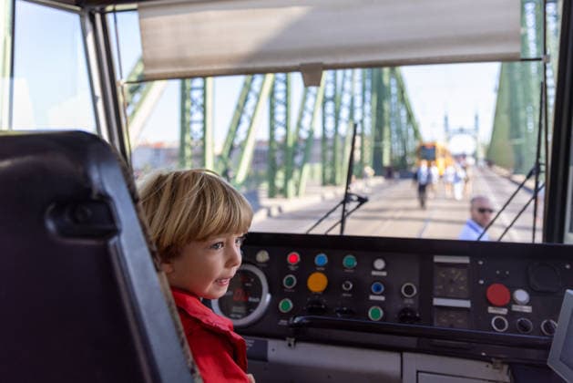 (260919) -- BUDAPEST, Sept. 19, 2026 -- A child visits the interior of a tram during a car-free weekend event in Budapest, Hungary, on Sept. 19, 2026. Budapest is holding a car-free weekend on Sept. 19-20 as part of European Mobility Week, promoting environmentally friendly and sustainable travel through public transport vehicle displays, cycling activities and family events. ) HUNGARY-BUDAPEST-CAR-FREE WEEKEND HuxZhixuan 