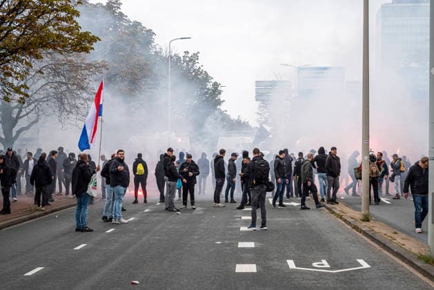 September 19, 2026, Den Haag - The Hague, South Holland, The Netherlands Holland: September 19, 2026, The Hague, the Netherlands. Far-right protesters temporarily block a main road in The Hague. Several hundred anti-immigration and anti-government demonstrators gathered on the Malieveld under the banner Wij Zijn Het Volk, throwing fireworks and uprooted traffic bollards at riot police, who deployed a water cannon. Authorities banned the planned march, dissolved the demonstration, and imposed an emergency order over much of the city center. Den Haag - The Hague The Netherlands Holland  - ZUMAp202 20260919_zip_p202_002 Copyright: xJamesxPetermeierx