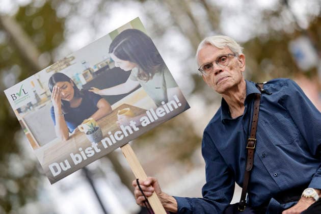 Protesters at the fourth March for Life in Cologne. A protester holds a sign depicting a woman who appears overwhelmed by her pregnancy, along with the slogan You are not alone. The March for Life is a demonstration organized by Copyright: xChristophxHardtx