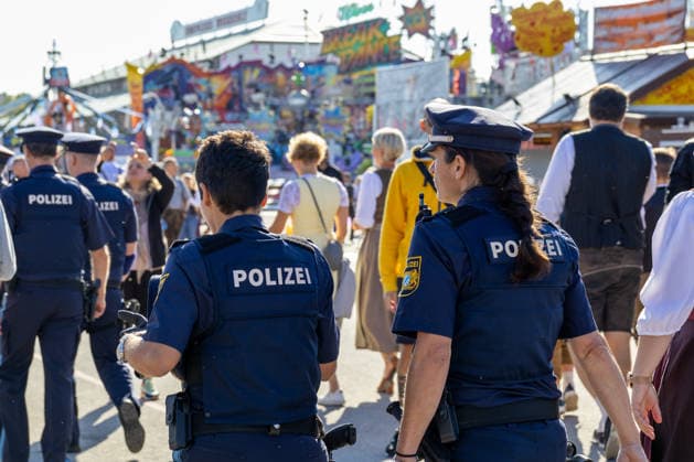 Munich, Bavaria, Germany September 19, 2026: Police officers are maintaining a strong presence on the festival grounds during the 191st Oktoberfest in 2026. The officers are part of the security plan and are ensuring safety and order among the visitors
