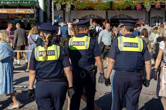 Munich, Bavaria, Germany September 19, 2026: Police officers are maintaining a strong presence on the festival grounds during the 191st Oktoberfest in 2026. The officers are part of the security plan and are ensuring safety and order among the visitors