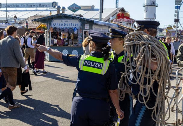 Munich, Bavaria, Germany September 19, 2026: Police officers are maintaining a strong presence on the festival grounds during the 191st Oktoberfest in 2026. The officers are part of the security plan and are ensuring safety and order among the visitors