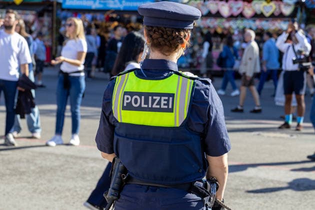 Munich, Bavaria, Germany September 19, 2026: Police officers are maintaining a strong presence on the festival grounds during the 191st Oktoberfest in 2026. The officers are part of the security plan and are ensuring safety and order among the visitors