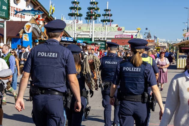 Munich, Bavaria, Germany September 19, 2026: Police officers are maintaining a strong presence on the festival grounds during the 191st Oktoberfest in 2026. The officers are part of the security plan and are ensuring safety and order among the visitors