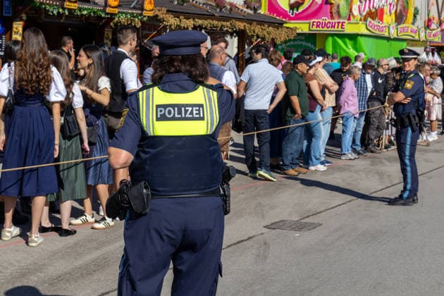 Munich, Bavaria, Germany September 19, 2026: Police officers are maintaining a strong presence on the festival grounds during the 191st Oktoberfest in 2026. The officers are part of the security plan and are ensuring safety and order among the visitors