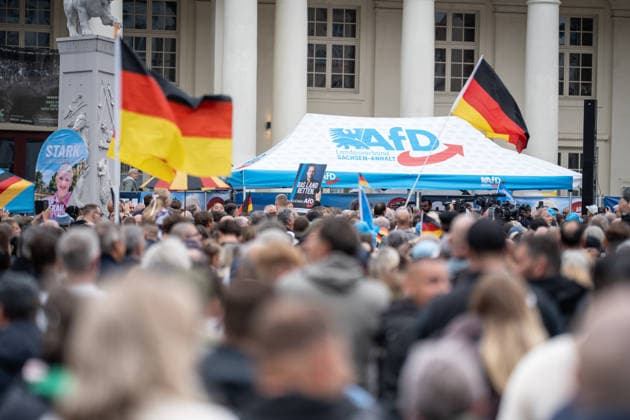 Scenes from the closing event in Schwerin featuring AfD flags marking the end of the campaign for the 2026 state election in Mecklenburg-Western Pomerania, held in Schwerin, Schwerin, Mecklenburg-Western Pomerania, Germany, at the Markt