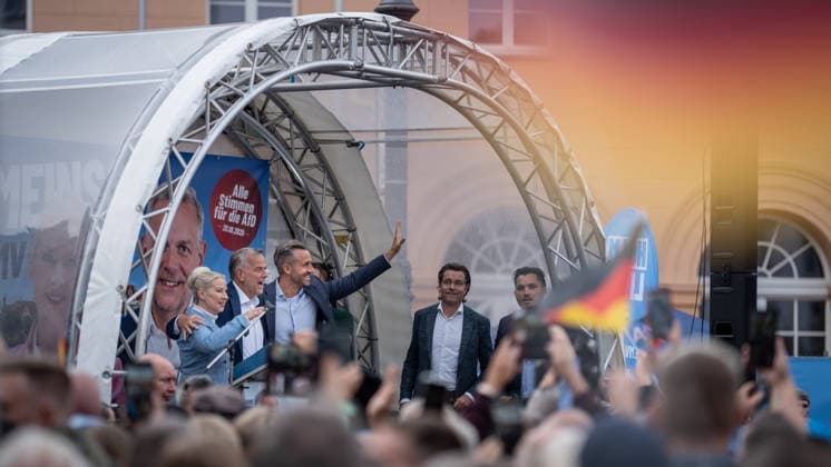 Petra Federau, AfD state legislator; Leif Eric Holm, AfD candidate for minister-president; Ulrich Siegmund, AfD Saxony-Anhalt—on stage, from left to right—at the AfD’s closing campaign rally for the 2026 state election in Mecklenburg-Western Pomerania, in Schwerin, Schwerin, Mecklenburg-Western Pomerania, Germany, at Am Markt