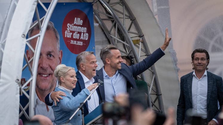 Petra Federau, AfD state legislator; Leif Eric Holm, AfD candidate for minister-president; Ulrich Siegmund, AfD Saxony-Anhalt—on stage, from left to right—at the AfD’s closing campaign rally for the 2026 state election in Mecklenburg-Western Pomerania, in Schwerin, Schwerin, Mecklenburg-Western Pomerania, Germany, at Am Markt