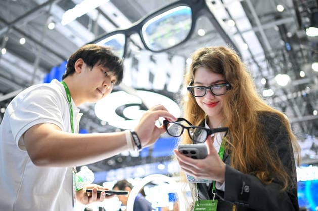 2026 WMC Held in Hefei HEFEI, CHINA - SEPTEMBER 20, 2026 - A foreign visitor tried on the AI glasses at the 2026 World Manufacturing Convention at Binhui International Convention Center in Hefei, Anhui Province, China on September 20, 2026. Hefei Anhui China  Copyright: xCFOTOx i1789926043685