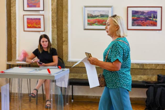 RUSSIA, SEVASTOPOL - SEPTEMBER 20, 2026: A woman visits a polling station at the Centre of Culture and Arts on Lenin Street to vote in the 2026 Russian legislative election held on September 18 to 20 and including regional parliamentary and local elections as well as the election to the Russian State Duma of the 9th convocation. Sergei Malgavko TASS  98015542