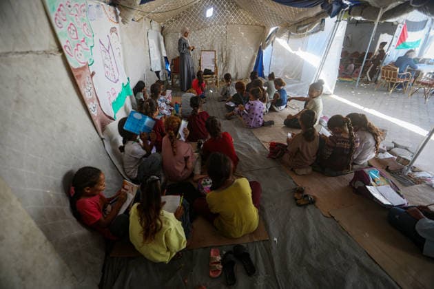 Palestinian Children Attend Class in Temporary Tent in Gaza City Palestinian children attend a lesson inside a temporary educational tent while sitting on the ground in western Gaza City on September 20, 2026. Thousands of children are resuming their education in tents after years of disruption caused by the war, amid widespread damage to schools and shortages of educational facilities, while the temporary classrooms lack the basic equipment and services needed for a suitable learning environment. Photo by Bilal Osama apaimages Gaza city Gaza Strip Palestinian Territory 200926_Gaza_BO_00(9) Copyright: xapaimagesxBilalxOsamax xapaimagesx