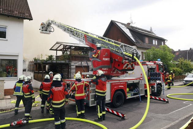 A turntable ladder being used to fight a fire on Pestalozzistraße, at the former Naturstein Stefan Wormser workshop building, located at the intersection of Pestalozzistraße and Friedhofsweg in Pegnitz, September 20, 2026, Upper Franconia, Bavaria,