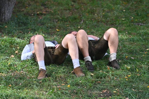 Drunk, passed-out revelers, beer corpses, lie on the vomit mound to sober up on September 20, 2026—the 191st Oktoberfest, held from September 19 to October 4, 2026, at the Theresienwiese in Munich