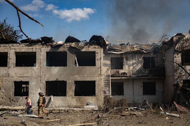September 20, 2026, Kramatorsk, Donetsk, Ukraine: A firefighter walks alongside a worker in a school destroyed by a Russian airstrike that was serving as an evacuation center in Kramatorsk. Kramatorsk Ukraine  - ZUMAb286 20260920_zip_b286_017 Copyright: xFranciscoxRichartx