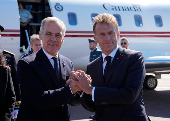 September 20, 2026, Saint-Pierre, France: French President Emmanuel Macron, right, greets Prime Minister Mark Carney as he arrives in Saint-Pierre, Saint-Pierre-et-Miquelon, a French territory 20 kilometres off the southern coast of Newfoundland, on Sunday, Sept. 20, 2026. Saint-Pierre France - ZUMAc35_ 20260920_zaf_c35_007 Copyright: xAdrianxWyldx