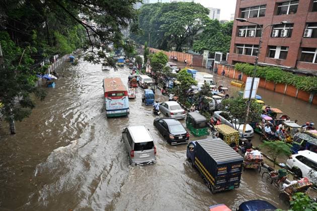 September 20, 2026, Dhaka, Bangladesh: DHAKA, BANGLADESH, SEPTEMBER 20, 2026: Vehicles and passengers navigate waterlogged streets in Dhaka following heavy rainfall in the Bangladeshi capital. Floodwater submerged sections of roads across the city, disrupting traffic and making travel difficult for residents and commuters. Dhaka Bangladesh - ZUMAq101 20260920_zna_q101_066 Copyright: xMamunurxRashidx