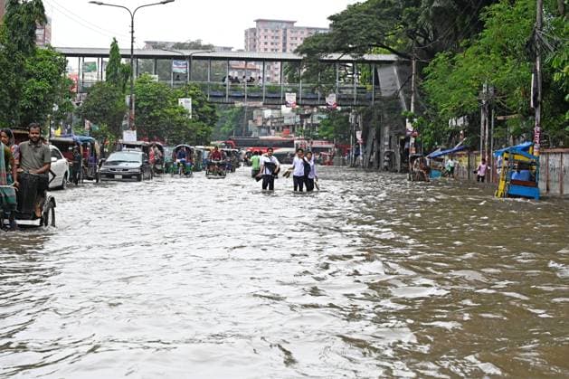 September 20, 2026, Dhaka, Bangladesh: DHAKA, BANGLADESH, SEPTEMBER 20, 2026: Vehicles and passengers navigate waterlogged streets in Dhaka following heavy rainfall in the Bangladeshi capital. Floodwater submerged sections of roads across the city, disrupting traffic and making travel difficult for residents and commuters. Dhaka Bangladesh - ZUMAq101 20260920_zna_q101_070 Copyright: xMamunurxRashidx