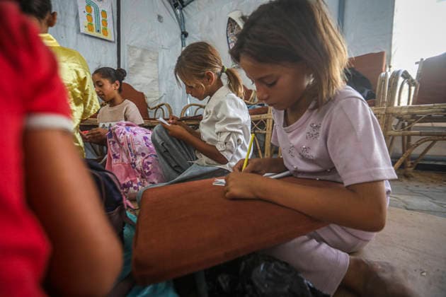 Gaza Temporary Tent Classrooms Palestinian girls sit with notebooks and school materials inside a temporary classroom tent in western Gaza City, Gaza Strip on September 20, 2026. Thousands of Palestinian children in the Gaza Strip have resumed lessons in temporary classrooms as the education system continues to face widespread disruption and damage following the war. Temporary learning spaces, including tents, are being used as schools and educational facilities remain damaged or unavailable. Gaza Gaza Strip Palestinian Territories Copyright: xFaizxQreqax