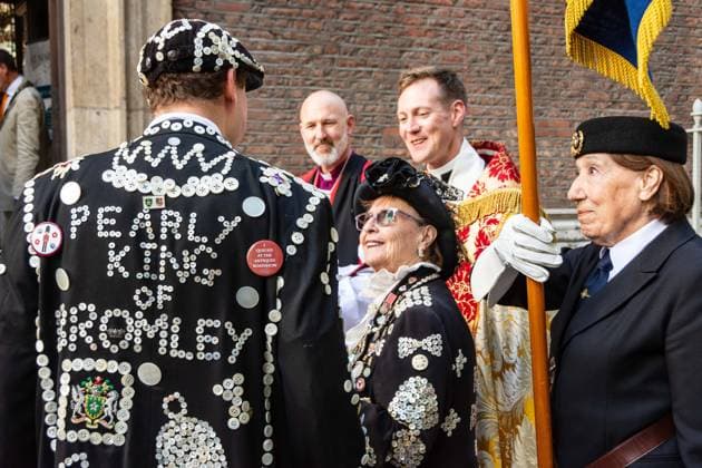 September 20, 2026, London, London, England: Pearly Kings and QueenÃ¢â‚¬â ¢s of London gather with city Mayors, Chelsea pensioner war veterans and dignitaries at Guildhall Yard for the annual Costermongers Harvest Festival celebration. Morris dancers and choirs performed along with the Pearly Kings and Queens who led a sing-a-long of traditional favourite songs such as: Ã¢â‚¬ËœKnees up Mother BrownÃ¢â‚¬â ¢ and Ã¢â‚¬ËœDoing the Lambeth walkÃ¢â‚¬â ¢. A procession followed to the spiritual home of LondonÃ¢â‚¬â ¢s Ã¢â‚¬ËœEastendersÃ¢â‚¬â ¢ at St Mary-le-Bow Church. Tradition has it that anyone born within earshot of the Bow Bells can claim to be a true Cockney. The march was led by a pearly prince carrying a plaited loaf of bread that was prese - ZUMAr169 20260920_zip_r169_025 Copyright: xRodxHarbinsonx