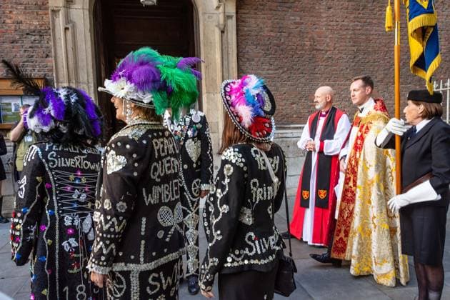 September 20, 2026, London, London, England: Pearly Kings and QueenÃ¢â‚¬â ¢s of London gather with city Mayors, Chelsea pensioner war veterans and dignitaries at Guildhall Yard for the annual Costermongers Harvest Festival celebration. Morris dancers and choirs performed along with the Pearly Kings and Queens who led a sing-a-long of traditional favourite songs such as: Ã¢â‚¬ËœKnees up Mother BrownÃ¢â‚¬â ¢ and Ã¢â‚¬ËœDoing the Lambeth walkÃ¢â‚¬â ¢. A procession followed to the spiritual home of LondonÃ¢â‚¬â ¢s Ã¢â‚¬ËœEastendersÃ¢â‚¬â ¢ at St Mary-le-Bow Church. Tradition has it that anyone born within earshot of the Bow Bells can claim to be a true Cockney. The march was led by a pearly prince carrying a plaited loaf of bread that was prese - ZUMAr169 20260920_zip_r169_033 Copyright: xRodxHarbinsonx