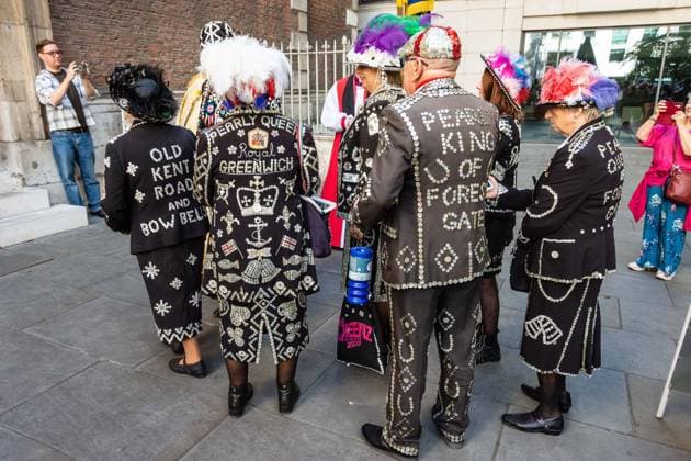 September 20, 2026, London, London, England: Pearly Kings and QueenÃ¢â‚¬â ¢s of London gather with city Mayors, Chelsea pensioner war veterans and dignitaries at Guildhall Yard for the annual Costermongers Harvest Festival celebration. Morris dancers and choirs performed along with the Pearly Kings and Queens who led a sing-a-long of traditional favourite songs such as: Ã¢â‚¬ËœKnees up Mother BrownÃ¢â‚¬â ¢ and Ã¢â‚¬ËœDoing the Lambeth walkÃ¢â‚¬â ¢. A procession followed to the spiritual home of LondonÃ¢â‚¬â ¢s Ã¢â‚¬ËœEastendersÃ¢â‚¬â ¢ at St Mary-le-Bow Church. Tradition has it that anyone born within earshot of the Bow Bells can claim to be a true Cockney. The march was led by a pearly prince carrying a plaited loaf of bread that was prese  - ZUMAr169 20260920_zip_r169_034 Copyright: xRodxHarbinsonx