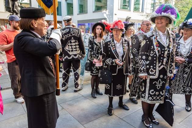 September 20, 2026, London, London, England: Pearly Kings and QueenÃ¢â‚¬â ¢s of London gather with city Mayors, Chelsea pensioner war veterans and dignitaries at Guildhall Yard for the annual Costermongers Harvest Festival celebration. Morris dancers and choirs performed along with the Pearly Kings and Queens who led a sing-a-long of traditional favourite songs such as: Ã¢â‚¬ËœKnees up Mother BrownÃ¢â‚¬â ¢ and Ã¢â‚¬ËœDoing the Lambeth walkÃ¢â‚¬â ¢. A procession followed to the spiritual home of LondonÃ¢â‚¬â ¢s Ã¢â‚¬ËœEastendersÃ¢â‚¬â ¢ at St Mary-le-Bow Church. Tradition has it that anyone born within earshot of the Bow Bells can claim to be a true Cockney. The march was led by a pearly prince carrying a plaited loaf of bread that was prese - ZUMAr169 20260920_zip_r169_038 Copyright: xRodxHarbinsonx