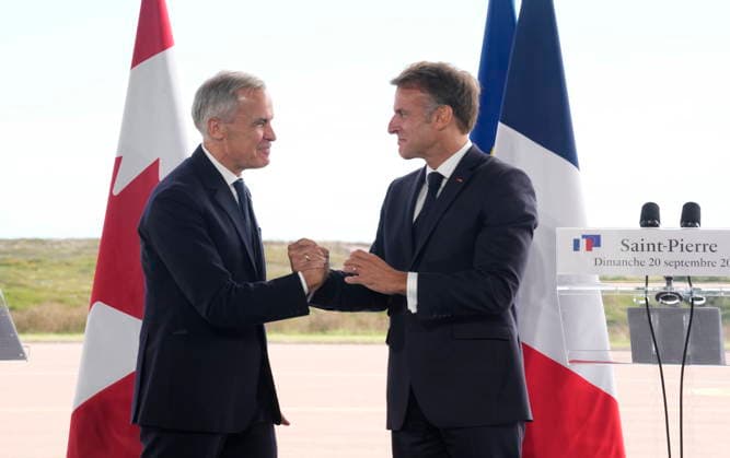 September 20, 2026, Saint-Pierre, France: French President Emmanuel Macron, right, and ..Prime Minister Mark Carney embrace after delivering remarks in Saint-Pierre, Saint-Pierre-et-Miquelon, a French territory 20 kilometres off the southern coast of Newfoundland, on Sunday, Sept.20, 2026. Saint-Pierre France - ZUMAc35_ 20260920_zaf_c35_049 Copyright: xAdrianxWyldx