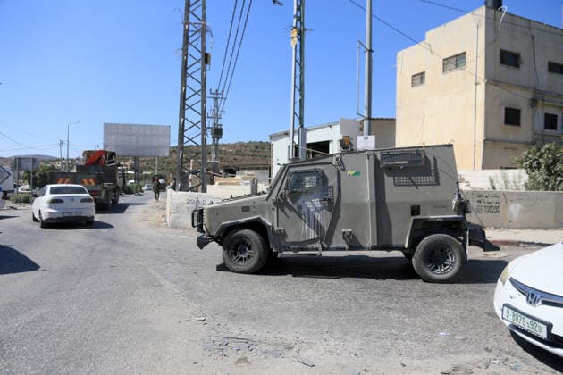 September 20, 2026, Nablus, West Bank, Palestine: An Israeli military jeep guards a street near a military checkpoint following a car-ramming attack carried out by a Palestinian near an Israeli military base south of the city of Jenin. The incident resulted in the death of one Palestinian and the injury of another by army fire. The Israeli army had closed roads southeast of Jenin and blocked the route connecting to other Palestinian cities. Nablus Palestine - ZUMAs197 20260920_aaa_s197_256 Copyright: xNasserxIshtayehx
