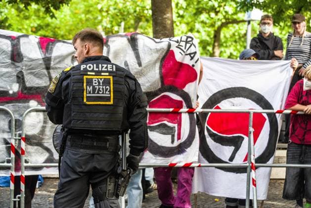 September 20, 2026, Munich, Bavaria, Germany: Coinciding with Oktoberfest, a group of right-extremists from the Identitaere Bewegung held a rally under the Banner of the Save Europe Act which includes, according to them, guidelines for the so-called Remigration. Some members discussed Remigration to include non-native born Germans, as they feel they can never be German, even if they hit all integration points. Critics in Germany see it as eyebrow-raising that the Identitaere leader, Martin Sellner, is an Austrian that is essentially making German policy and can play a greater role in government should the AfD take power. Munich Germany - ZUMAb160 20260920_abp_b160_014 Copyright: xSachellexBabbarx