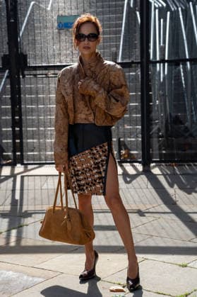 September 20, 2026, London, Camden, United Kingdom: An attendee arrives wearing a brown leather jacket matching hand bag at the Erdem catwalk show, held at the Roundhouse in Camden, London, as part of London Fashion Week 2026. Models and members of the fashion industry gather at the Roundhouse in Camden, London, for the Erdem catwalk show during London Fashion Week 2026. The event forms part of the official London Fashion Week schedule, bringing together models, designers, fashion professionals, media and guests for the presentation of Erdem s latest collection. London United Kingdom - ZUMAs197 20260920_aaa_s197_360 Copyright: xJamesxWilloughbyx
