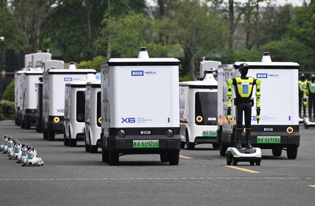 HANGZHOU, CHINA - SEPTEMBER 20: Multiple unmanned vehicles enter the venue led by an AI traffic management robot during the first Intelligent Robot Application Skills Exhibition Zhejiang Station on September 20, 2026 in Hangzhou, Zhejiang Province of China. The Zhejiang leg of the first Intelligent Robot Application Skills Exhibition, hosted by China Media Group (CMG), kicked off in Hangzhou, east China s Zhejiang Province, on Sunday.  Copyright: xChinaxNewsxServicex 111668235587