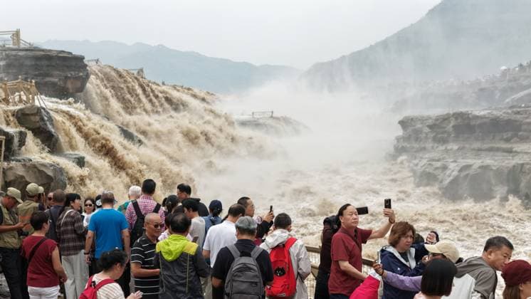 YAN AN, CHINA - SEPTEMBER 20: The water volume of the Hukou Waterfall on the Yellow River rises significantly due to sand discharge and flood release from upstream reservoirs on September 20, 2026 in Yan an, Shaanxi Province of China. The flow rate reached 1,800 cubic meters per second, merging the main and side waterfalls into a continuous line.  Copyright: xVCGx 111668265442