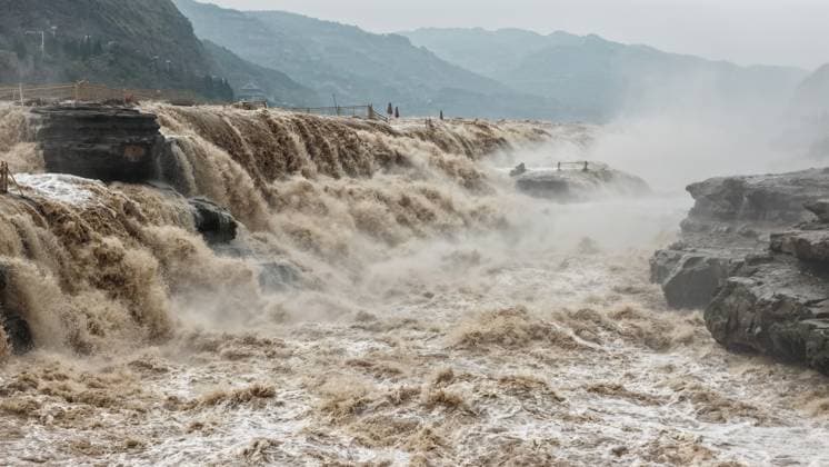 YAN AN, CHINA - SEPTEMBER 20: A large number of tourists visit the Hukou Waterfall on the Yellow River as water volume significantly increases due to sediment flushing and flood discharge from upstream reservoirs on September 20, 2026 in Yan an, Shaanxi Province of China. The flow rate reached 1,800 cubic meters per second, with the main and side waterfalls connecting to form a continuous cascade.  Copyright: xVCGx 111668265439