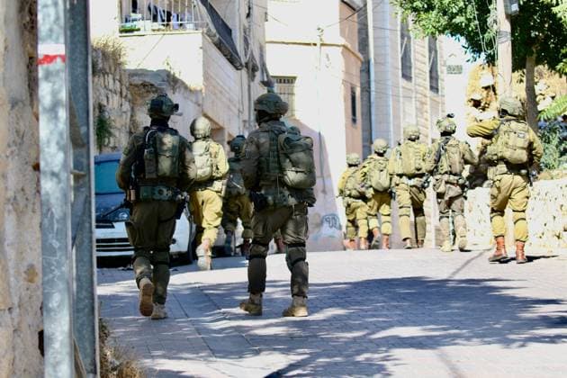 Israeli Forces Started Large-Scale Military Operation In Biddu BIDU, PALESTINE SEPTEMBER 21, 2026: Israeli forces continued a large-scale military operation in the town of Biddu, northwest of occupied Jerusalem, with raids on homes, searches, arrests and field interrogations. The operation began at around 1:00 AM, according to local sources. Israeli forces raided the home of a Palestinian man accused of carrying out the Nabi Saleh attack, taking measurements and digging into parts of the walls in preparation for a possible demolition or explosion, according to local reports. His family home was also raided, and his father and other family members were detained. Israeli forces also seized a house belonging to a resident and converted it Copyright: x xSalmanxMohsenxAlkhatibx xJNAxPressx