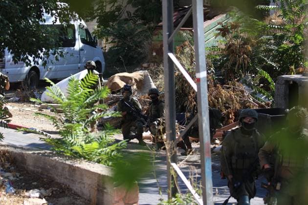 Israeli Forces Started Large-Scale Military Operation In Biddu BIDU, PALESTINE SEPTEMBER 21, 2026: Israeli forces continued a large-scale military operation in the town of Biddu, northwest of occupied Jerusalem, with raids on homes, searches, arrests and field interrogations. The operation began at around 1:00 AM, according to local sources. Israeli forces raided the home of a Palestinian man accused of carrying out the Nabi Saleh attack, taking measurements and digging into parts of the walls in preparation for a possible demolition or explosion, according to local reports. His family home was also raided, and his father and other family members were detained. Israeli forces also seized a house belonging to a resident and converted it Copyright: x xSalmanxMohsenxAlkhatibx xJNAxPressx